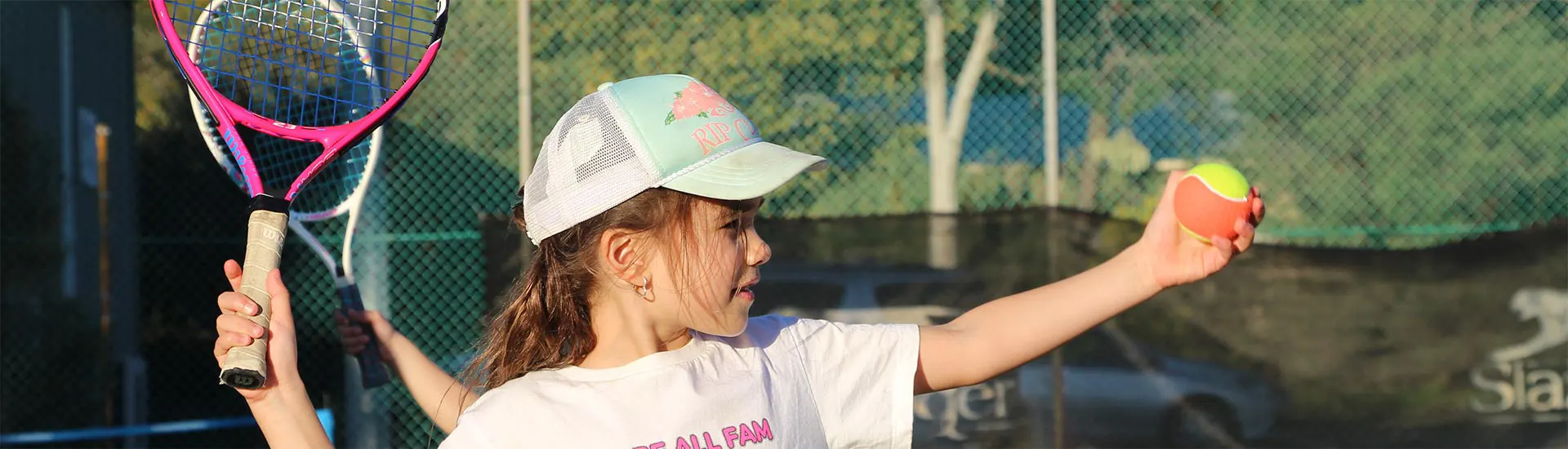 Young tennis player about to serve